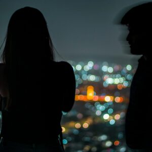 A couple, one with a blurred silhouette